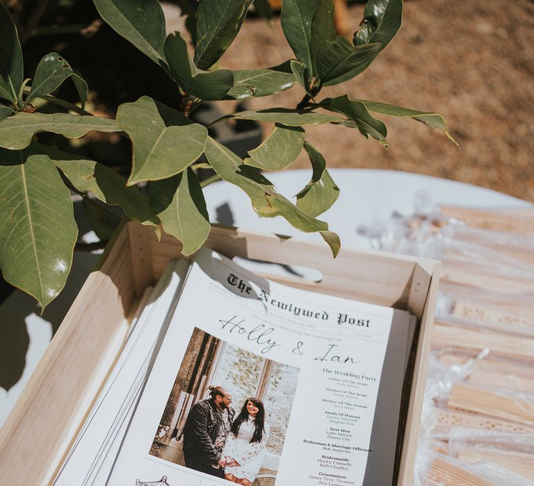 Personalised wedding newspaper stationery DIY'd by the bride for the country house wedding at Preston Court 