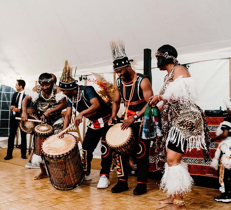 Adanta wedding dancers with drums at Broadfield Court wedding celebrating Nigerian and Chinese wedding traditions