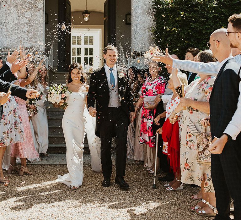 Confetti exit for the bride and groom after their traditional civil ceremony