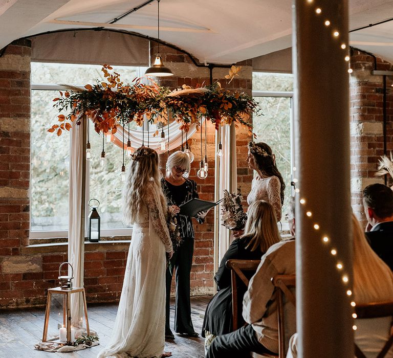 LGBTQIA+ same sex wedding with boho wedding decor and dried wedding flowers 