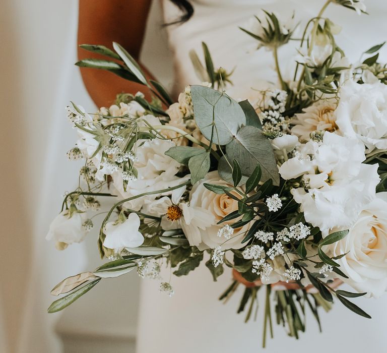 White wedding bouquet with roses and sweet pea 