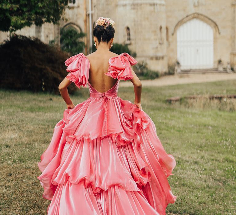 Elegant fairytale princess coloured wedding dress with ruffles in shade of pink 