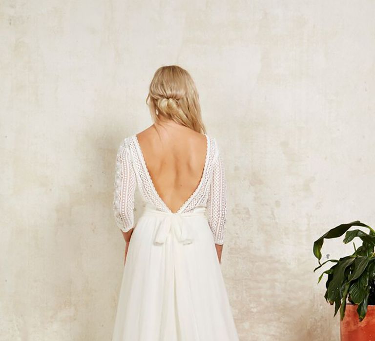 Sustainable wedding dress with long lace sleeves and silk waist sash from Indiebride London in boho style