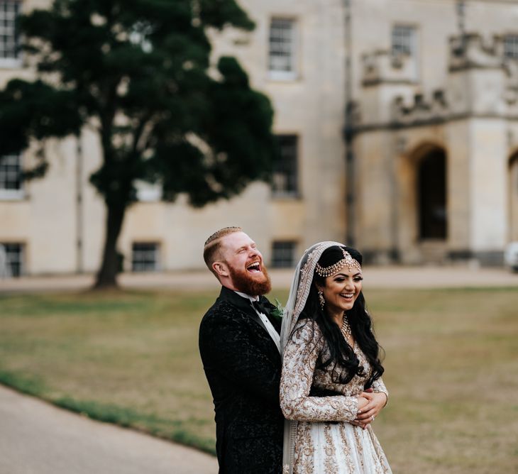 Bride and groom embracing at Syon Park Wedding