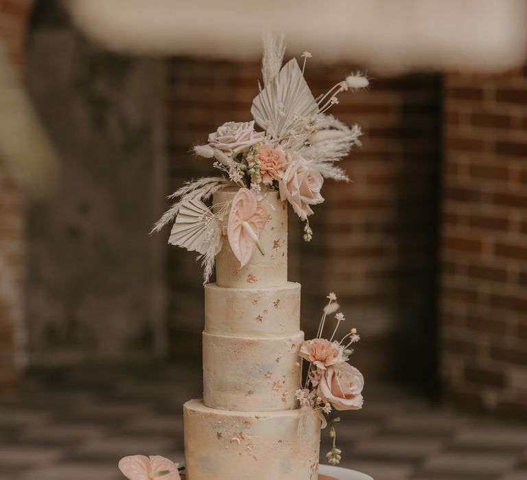 Sugar Plum Bakes wedding cake with tropical wedding flower decor 