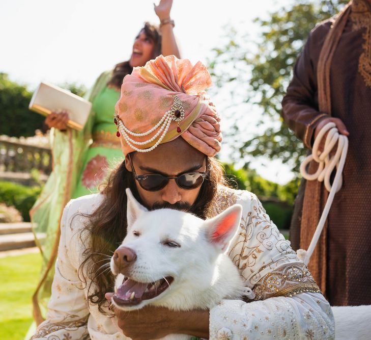 Groom kissing his dog at Euridge Manor wedding