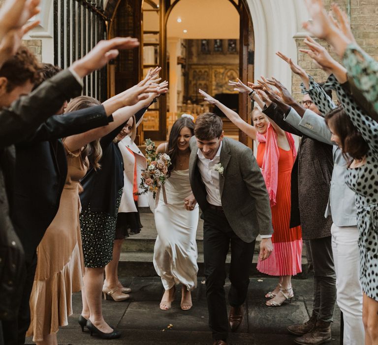 Human arch at Holy Trinity Brompton Church micro wedding