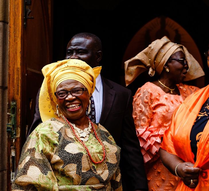 Wedding guests in traditional Nigerian outfits 