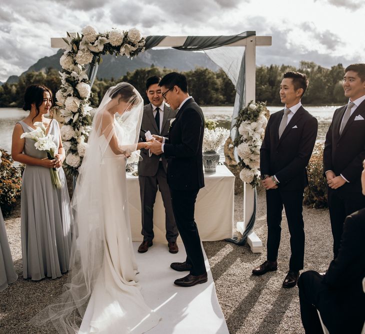 Bride and groom exchanging vows at outdoor wedding in Austria 