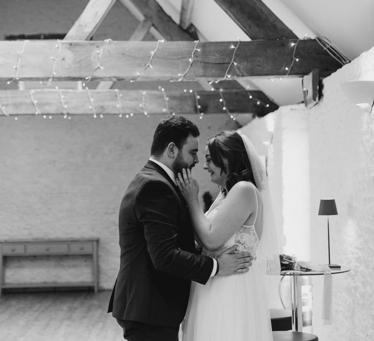 Happy bride and groom share emotional moment