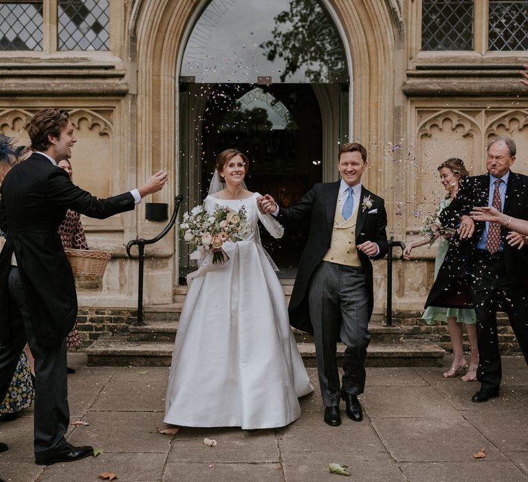 Confetti moment for bride and groom at London Church wedding