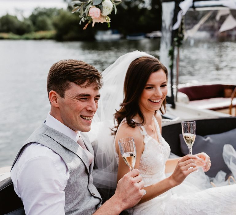 Bride & groom on boat during wedding reception 