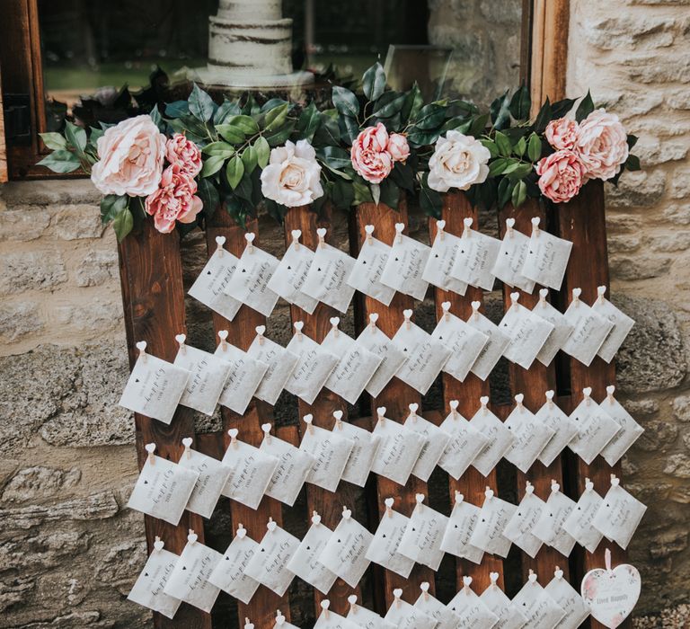 Small envelopes filled with confetti and pegged to a palette