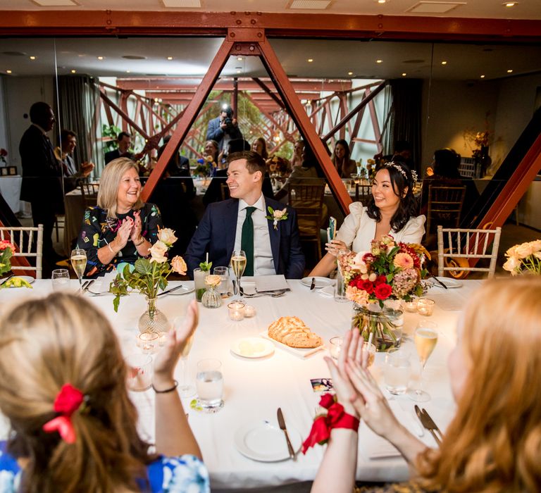 Groom with his new bride and mum during the micro wedding reception at Bluebird Cafe