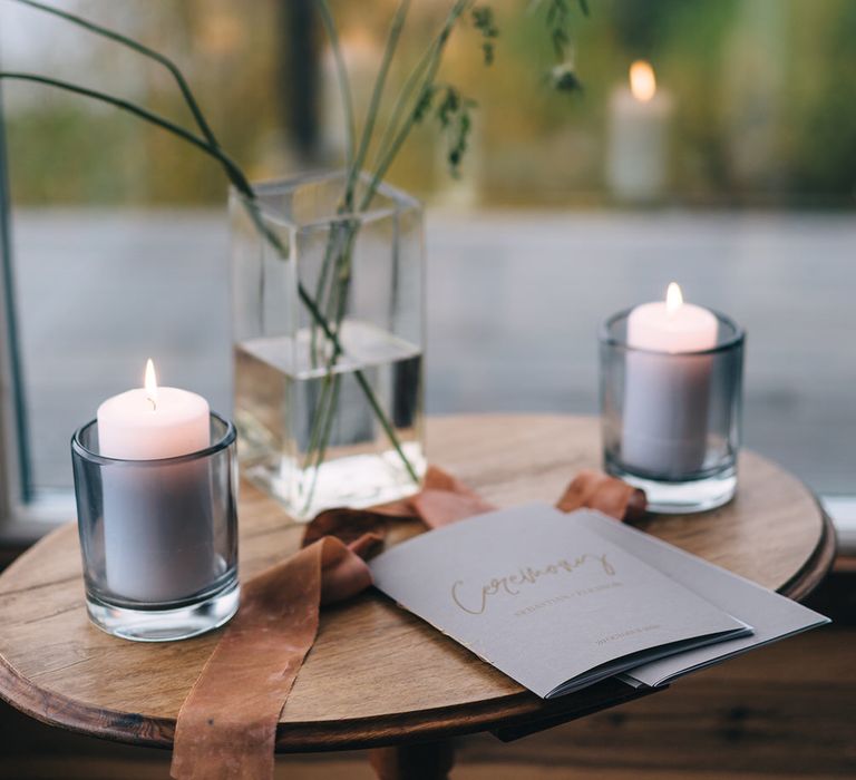 Simple candle decorations and minimal florals decorated the ceremony