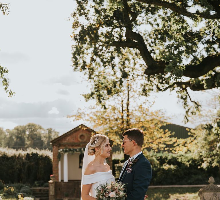 Bride & groom look at one another after wedding ceremony