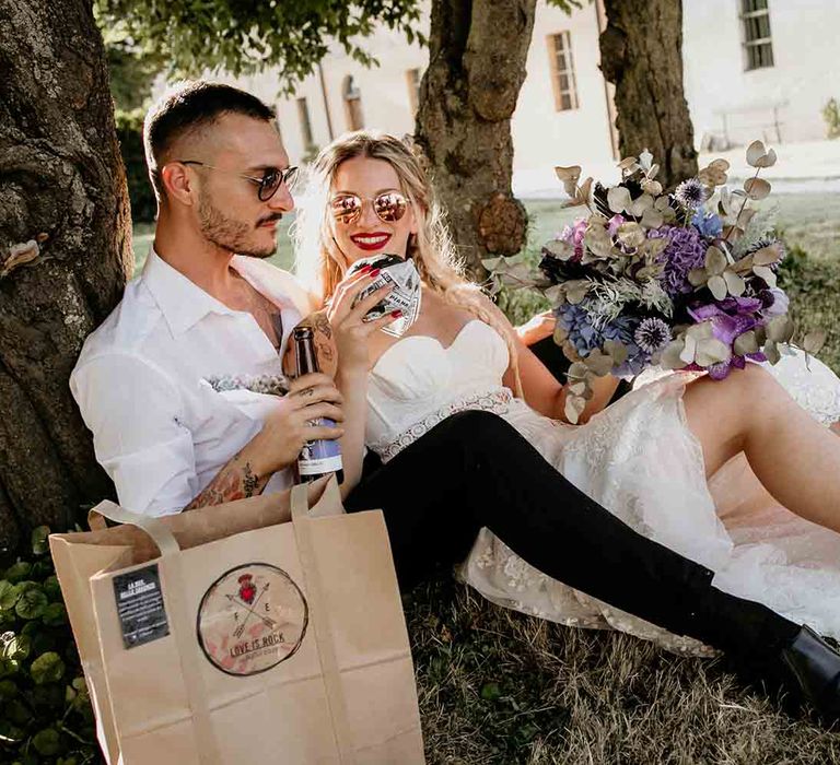 Bride and groom eat burgers and fries