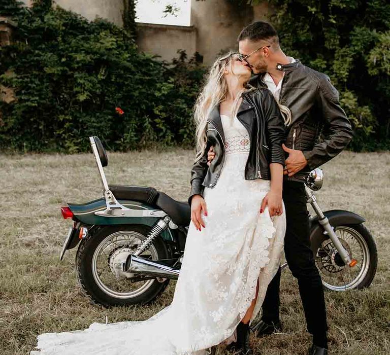 Bride and groom with motorbike at elopement shoot