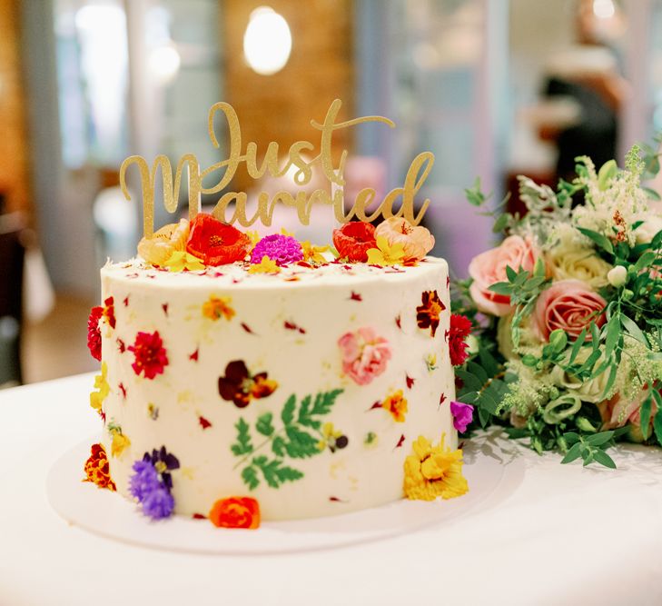 Buttercream wedding cake with edible flowers