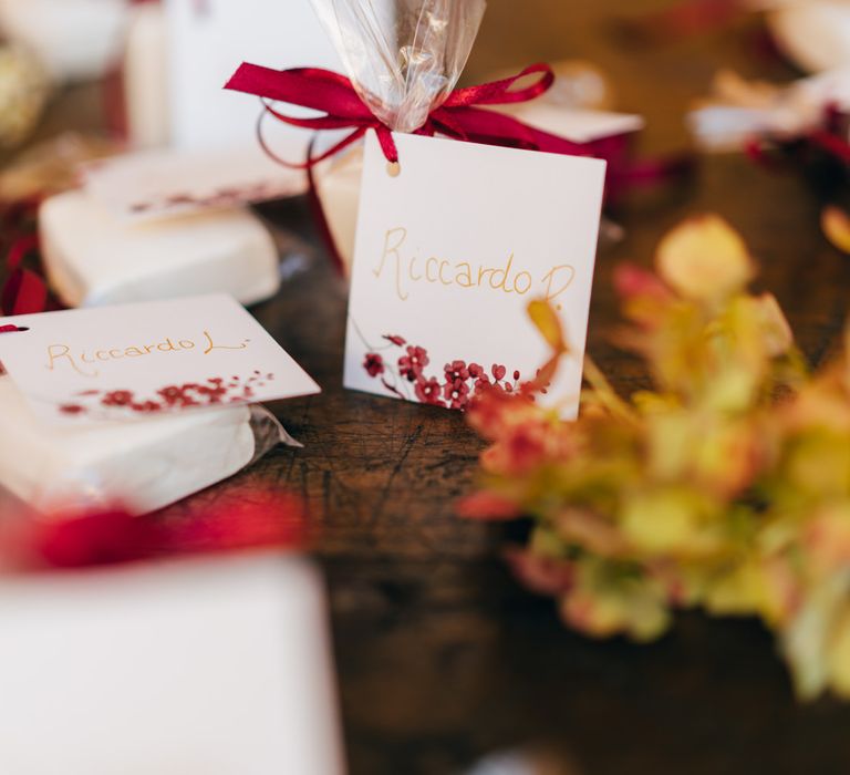 Personalised marshmallow wedding favours with a burgundy ribbon