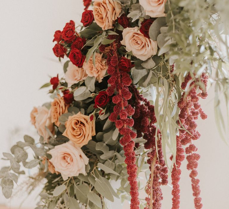 Green, peach and red wedding flowers