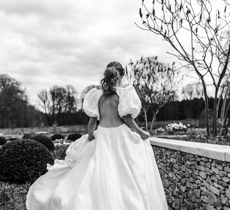 Stylish wedding dress with floaty wedding dress, puff sleeves and backless detail 