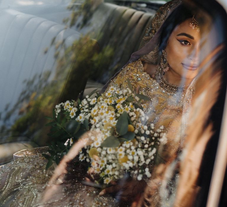 Bengali bride arriving in a vintage Mercedes' wedding car 