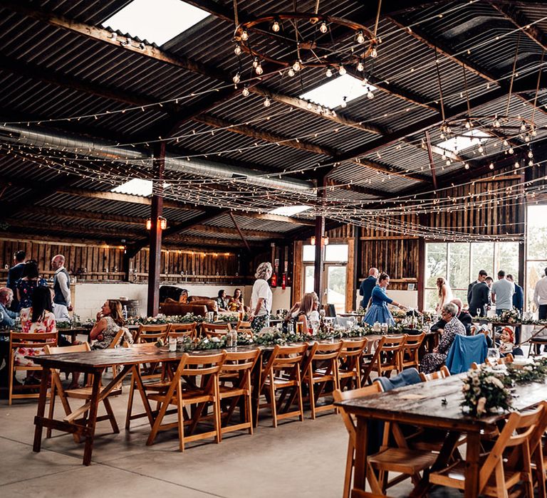 Rustic barn wedding venue with festoon lighting