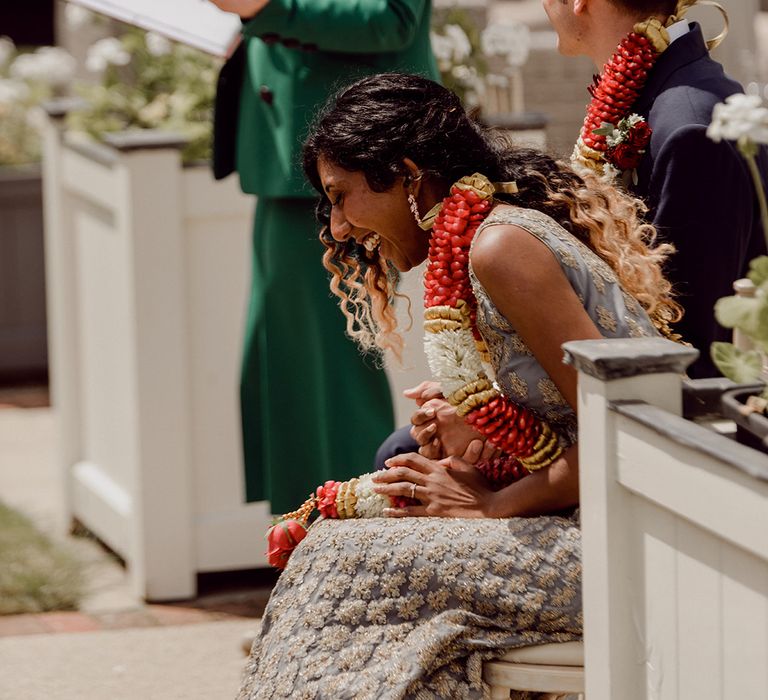 Bride & groom laugh during ceremony at celebrant  | Joshua Gooding Photography