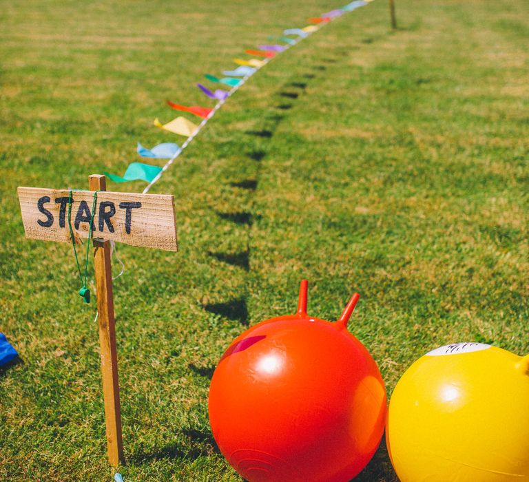 Garden wedding games on lush green lawn at Stone Barn | Story + Colour