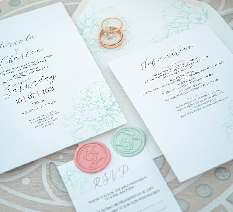 Pastel coloured wedding stationery suite with pink and green wax seals 