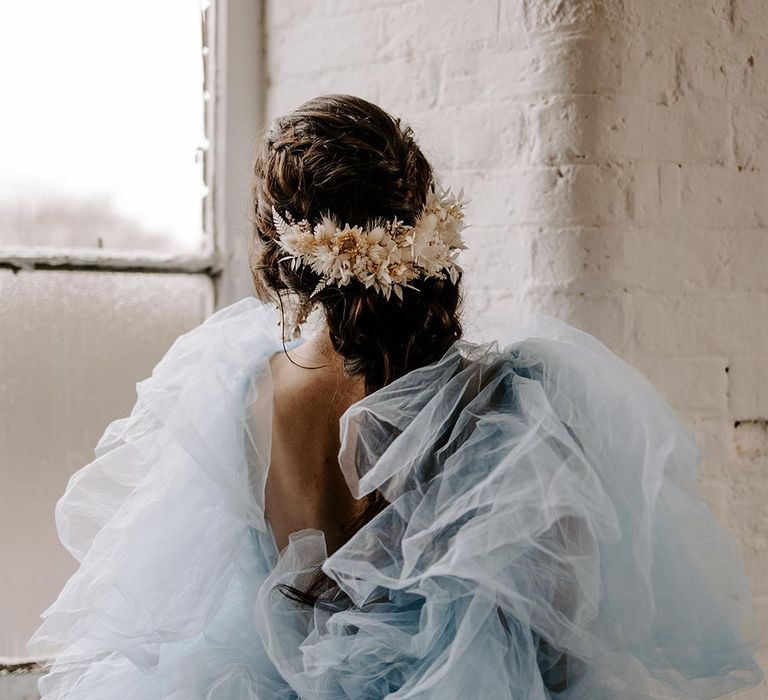 blue coloured wedding dress and beige dried flower comb wedding hair accessory 