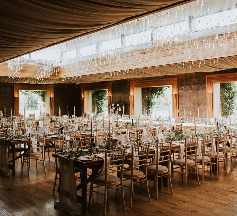 Romanic wedding in the Gillyflower at Elmore Court with candles and foliage table decor