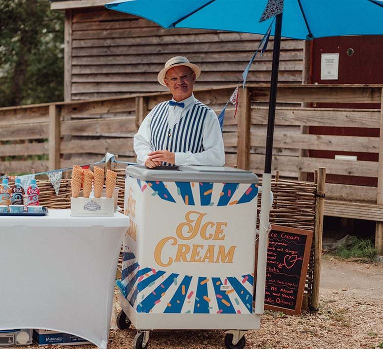 Ice cream stand for wedding guests with flavoured sauces and waffle cones