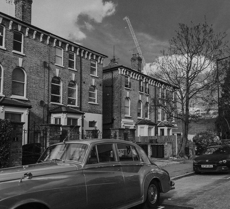 black and white picture of a vintage wedding car 