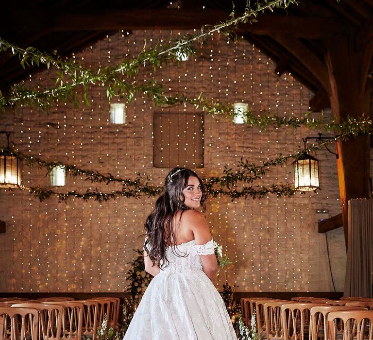 Bride in a lace princess wedding dress at East Riddlesden Hall Barn 