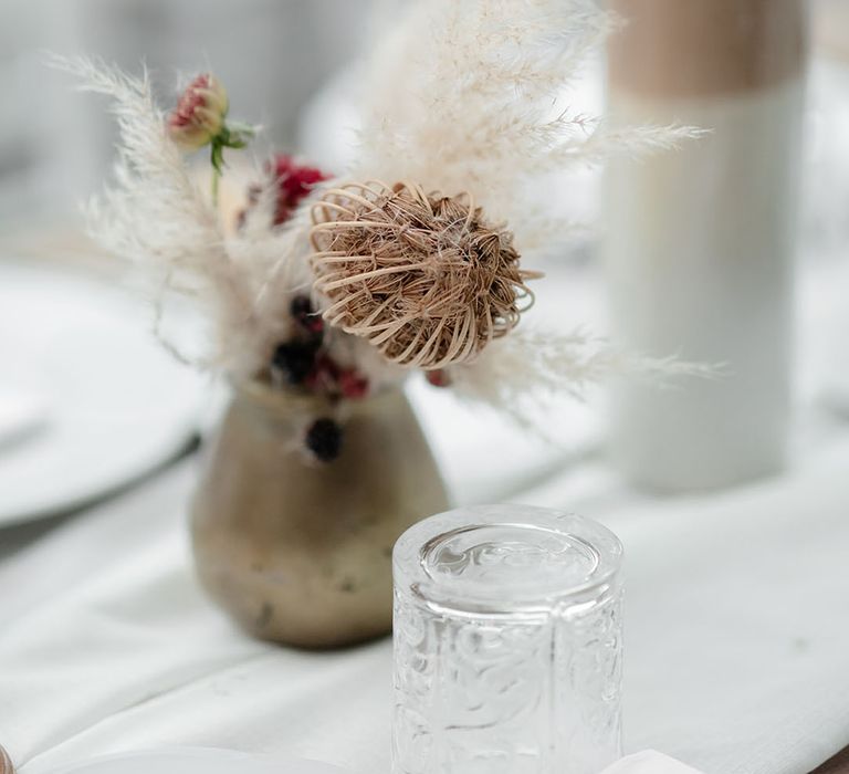 Pampas grass arrangements in white vases 