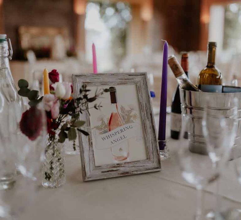 Personalised wedding table numbers with Whispering Angel Rose design in rustic frame on classic wedding tablescape