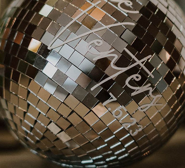 Disco ball personalised with the bride and groom's shared last name 