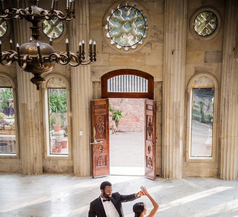 The bride and groom dance together in the ballroom at Shepstone Gardens 