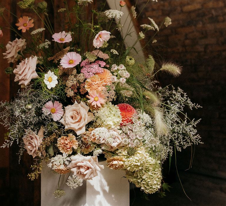 Pastel pink wedding flower arrangements for neutral retro glam wedding 