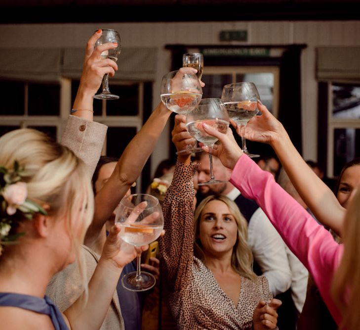 Guests toast the bride and groom