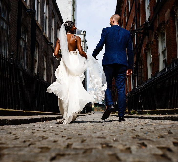 Urban bride and groom portrait by About Today Photography