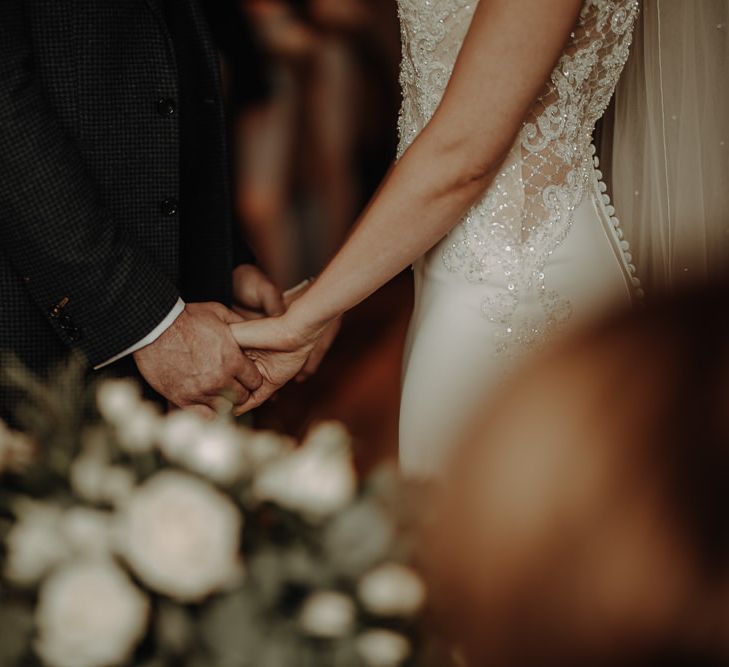 Romantic Morilee bridal gown with sequin embroidery and buttoned back