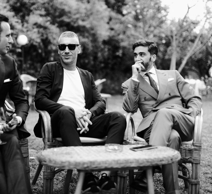 Guests relaxing at outdoor wedding in Italy 