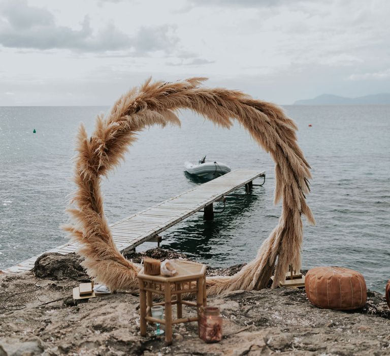 Pampas grass moon gate at pink and blue wedding