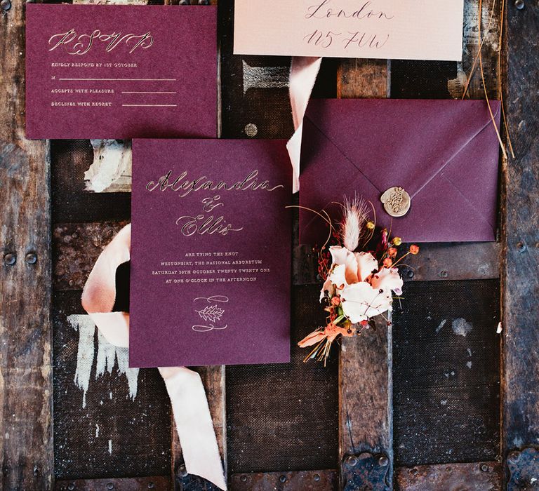 Burgundy red wedding stationery flat lay. Photography by Maryanne Weddings.