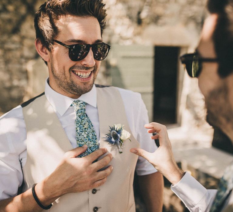 The groom wears a custom Caroline Andrews suit and Liberty London tie