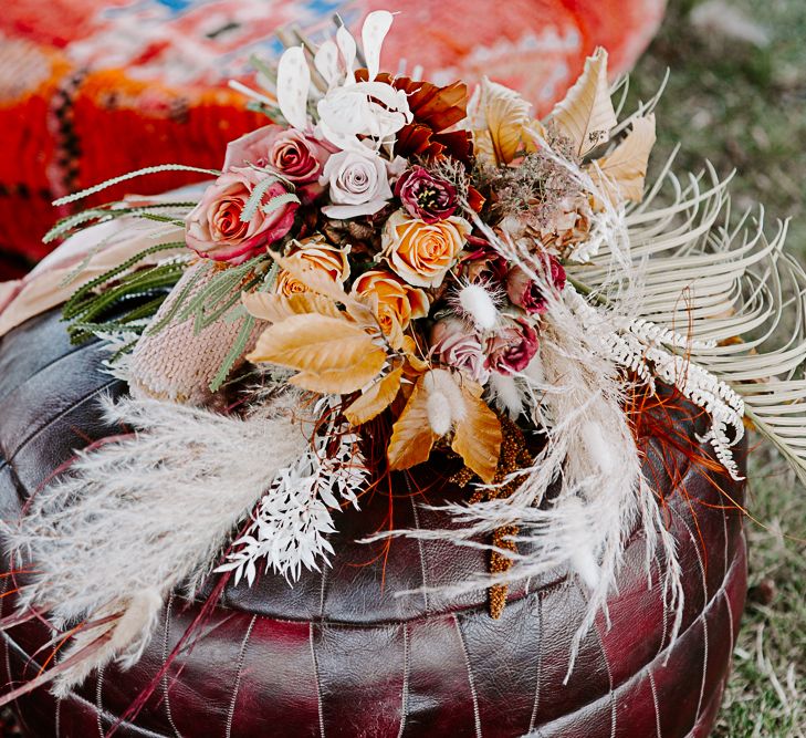 Dried floral arrangement complete in bright colours