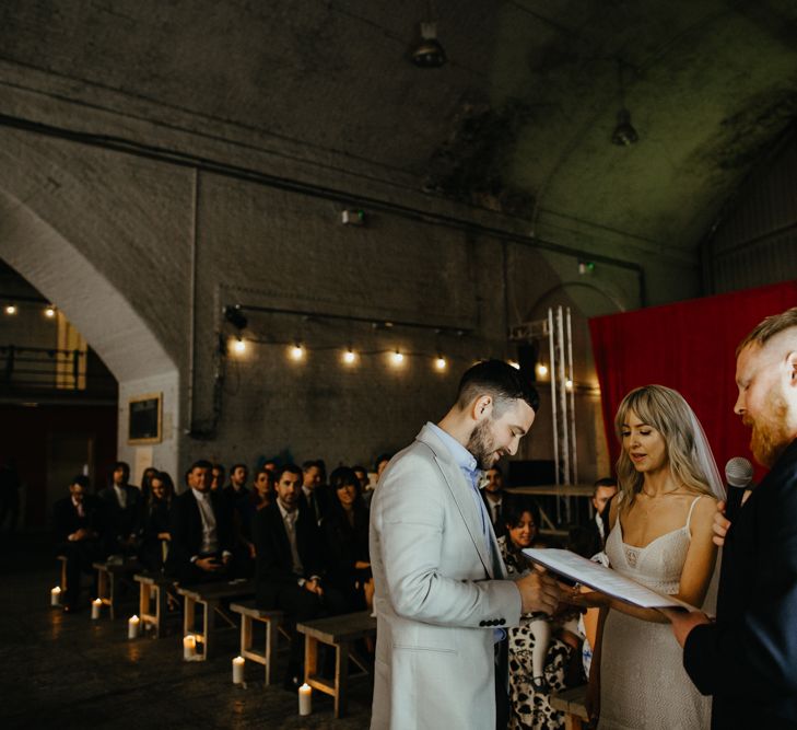 Wedding ceremony from celebrants perspective showing wedding couple and guests